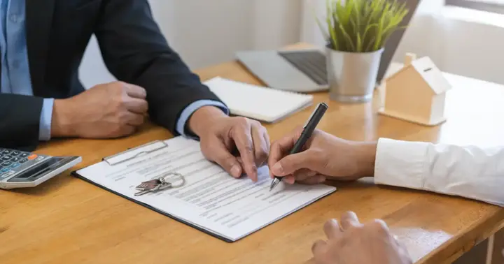 Tenant signing a lease agreement